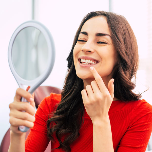 woman smiling in mirror