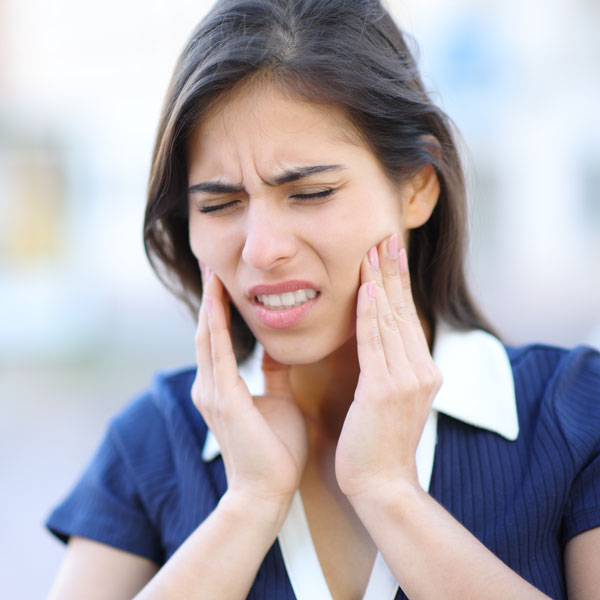 woman with jaw pain