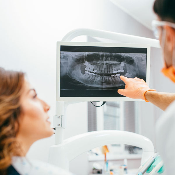 dentist pointing to x-ray