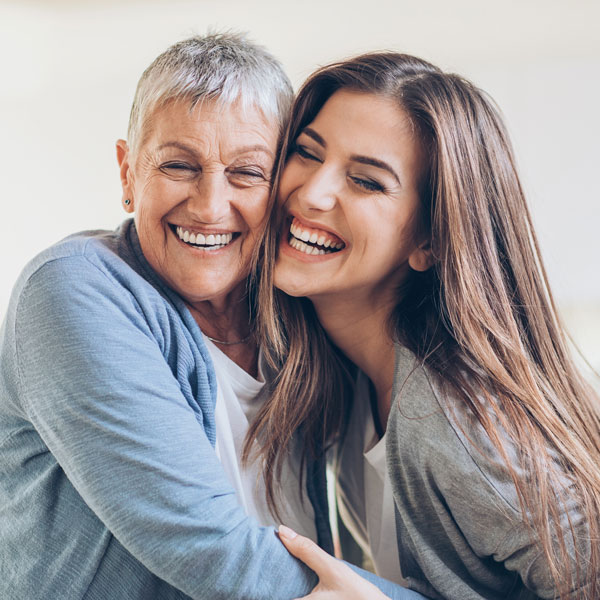 mother and daughter smiling