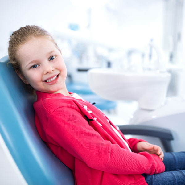 girl smiling in dental chair